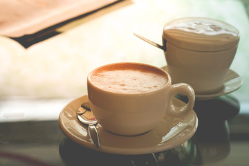 Hot coffee on the table macro closeup