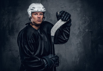 Fototapeta premium Portrait of hockey player with the gaming stick.