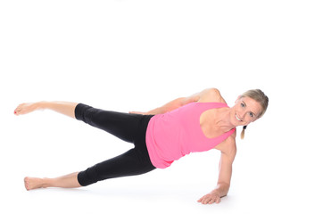 Beautiful woman doing plank abdominal exercises