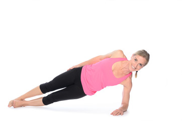 Beautiful woman doing plank abdominal exercises