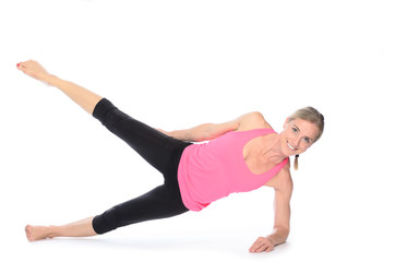 Fototapeta na wymiar Beautiful woman doing plank abdominal exercises