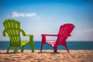 Two deckchairs on the beach