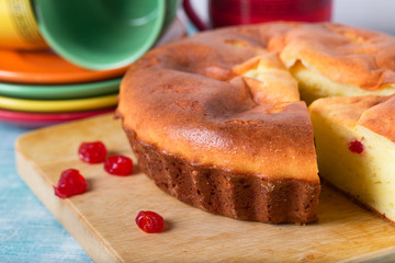 Home-made biscuit pie, red berries and cups