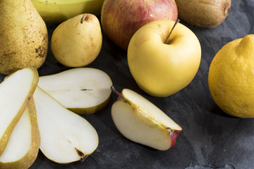 seasonal fruit served on a slate plate. Food and health