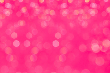 Bokeh glamour pink background with blurred rainbow lights. Festive background.