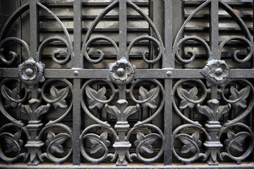 old wrought-iron flower ornament on windows
