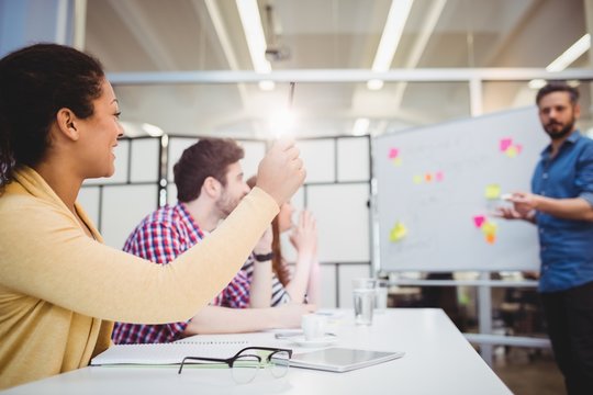 Colleagues in board room during brainstorming 