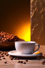 Cup of black coffee and  beans
