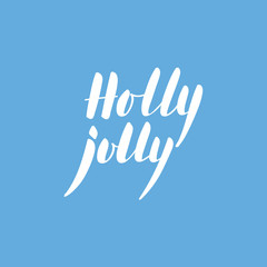 Obraz premium Calligraphic phrase Holly Jolly on blue background.