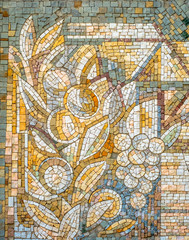 Colorful old stone mosaic on the wall bright tiles