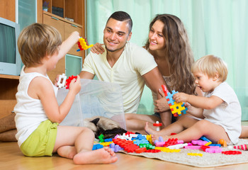 Happy family playing in home interior