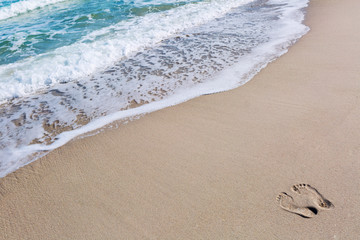 Footprints in the sand at the beach