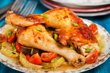 Roasted chicken legs with vegetables