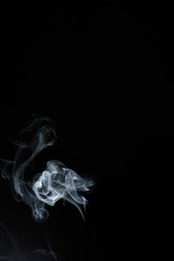 Fototapeta premium White or gray smoke isolated on dark background.