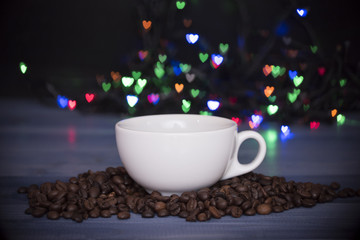 Cup with coffee and coffee beans