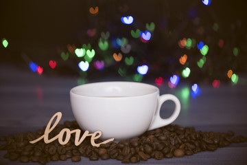 Cup with coffee and coffee beans with love symbol