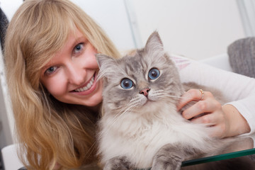 young woman with ragdoll cat