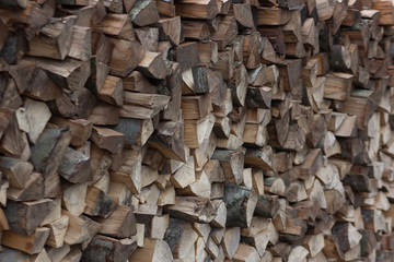 pile of firewood fuel wood woodpile fills the whole frame framed with angle