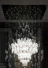 Huge pendant glass chandelier in Milan during the milanese design week