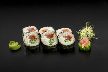 fresh made Japanese sushi rolls with tuna and cucumbers decorate