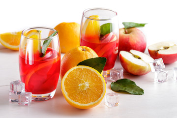 fresh mix syrup with orange, apple slice and ice cube