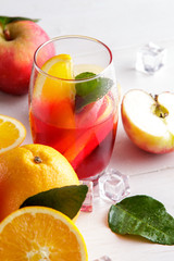 fresh fruit punch with orange and apple slice for refreshment