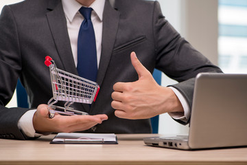 Businesswoman with shopping cart trolley