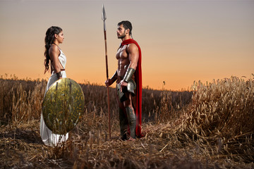 Spartan warrior and his woman in the field