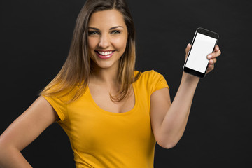 Naklejka premium Beautiful girl with a smartphone