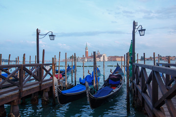 Fototapeta na wymiar Sunset in Venice, floating gondola