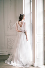 Bride. Young women with wedding dress in very bright room, some