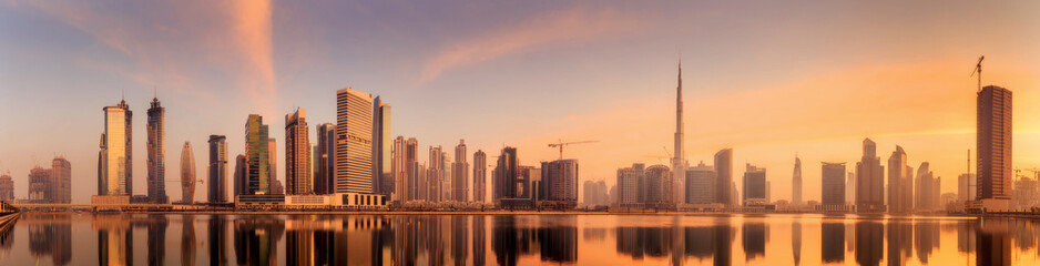 Panoramic view of Business bay and downtown area of Dubai, reflection in a river, UAE