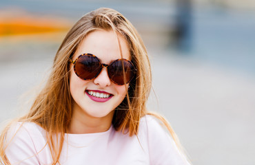 portrait of cute amazing smiling in sunglasses girl,