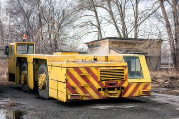 Old tow tractor on the outskirts of the airport