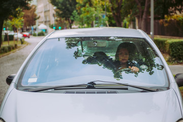 Fototapeta na wymiar Woman Driving A Car
