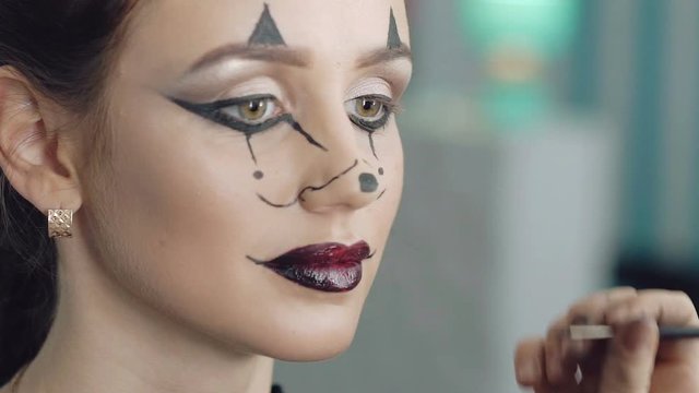 Make up artist make the girl halloween picture of mouse