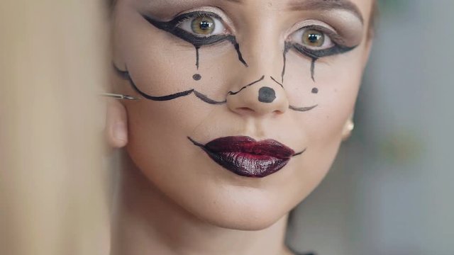 Make up artist make the girl halloween picture of mouse