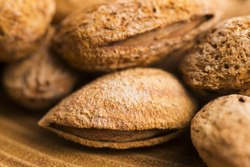 Heap of almond nuts in shell