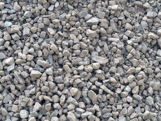dirty gravel, crushed stone in the sand