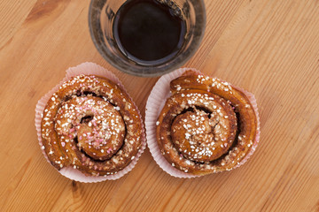 Fika coffee break of cinnamon bun and glass of coffee