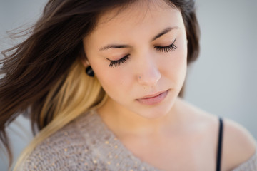 Portrait of a beautiful brunette. Close-up. Color toned.