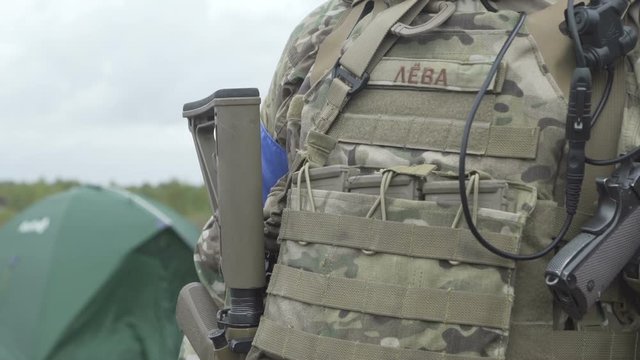 The soldier in a military uniform with a gun, airsoft game