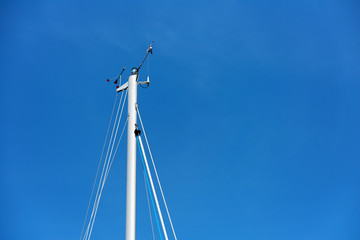 Mast on the sailboat and the blue sky