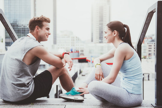 Happy athletic couple spending time together after workout.