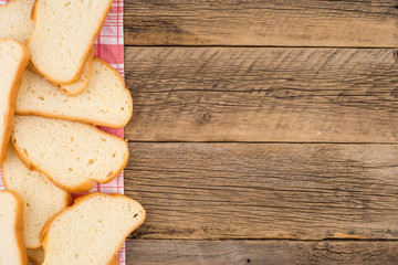 Loaf of bread on a wooden table. Top view