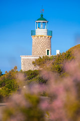 Skinari Lighthouse against Kefalonia island on Zakynthos island, Greece