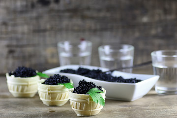 black caviar on a wooden background