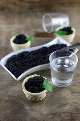 black caviar on a wooden background