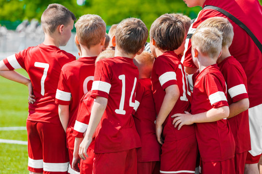 School Sports Team With Coach. Coach Motivational Talk With Young Boys Of Soccer Football Team Before The Final Game Of Youth Soccer Tournament