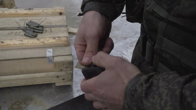 Soldiers load ammunition submachine magazines